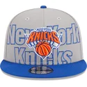graue-und-blaue-flatcap-snapback-9fifty-draft-edition-2023-der-new-york-knicks-nba-von-new-era