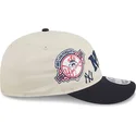beige-und-marineblaue-gebogene-snapback-kappe-9fifty-retro-crown-scatter-der-new-york-yankees-mlb-von-new-era