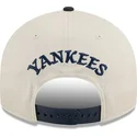 beige-und-marineblaue-gebogene-snapback-kappe-9fifty-retro-crown-scatter-der-new-york-yankees-mlb-von-new-era