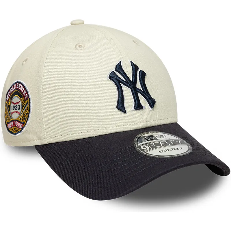 beige-und-marineblaue-verstellbare-curved-cap-mit-marineblauen-logo-9forty-world-series-der-new-york-yankees-mlb-von-new-era beige-und-marineblaue-verstellbare-curved-cap-mit-marineblauen-logo-9forty-world-series-der-new-york-yankees-mlb-von-new-era
