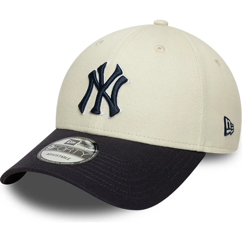 beige-und-marineblaue-verstellbare-curved-cap-mit-marineblauen-logo-9forty-world-series-der-new-york-yankees-mlb-von-new-era beige-und-marineblaue-verstellbare-curved-cap-mit-marineblauen-logo-9forty-world-series-der-new-york-yankees-mlb-von-new-era
