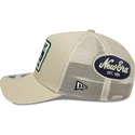 beige-trucker-cap-9forty-m-crown-a-frame-multi-patch-von-new-era